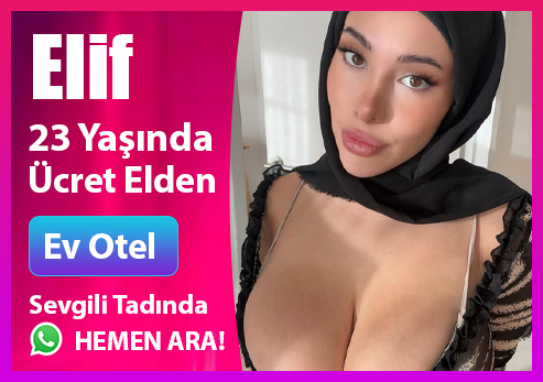 Sarı kazak giymiş sarışın İzmir escort, iç mekan rahat poz