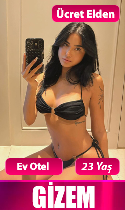 İzmir escort genç kadın, kırmızı elbise ile enerjik poz